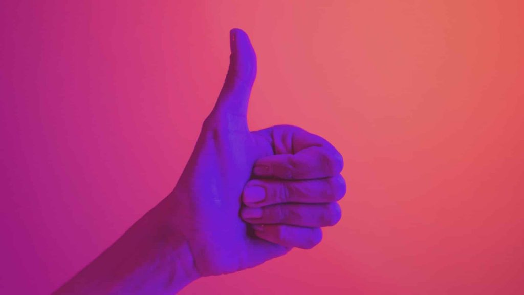 Photo of a thumbs-up, cover image for the blog about 'Reasons to Buy Instagram Likes.'