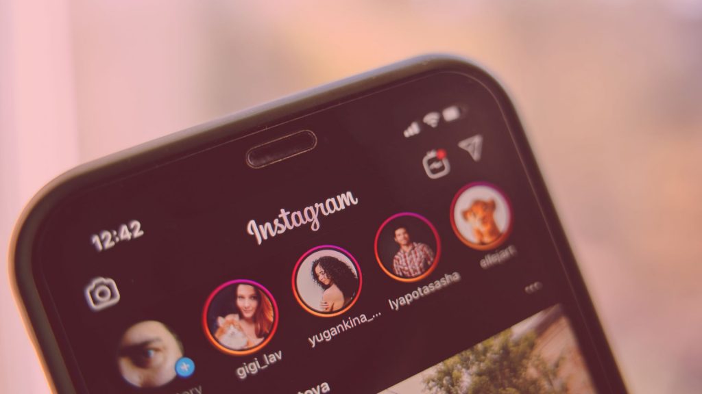 A phone displaying the top of the Instagram app, main image for the blog about the benefits of buying Instagram followers
