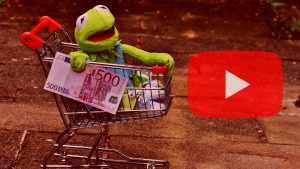 Kermit the Frog on a shopping cart next to the YouTube logo, cover image for an article about 'Reasons to Buy Views on YouTube