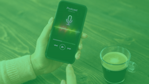 Mobile phone playing a podcast next to a coffee, cover image for an article about 'How much artists earn on Spotify in the United States.