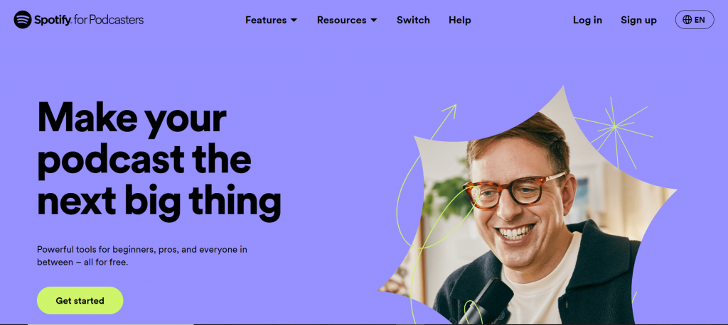 Spotify podcast platform homepage with a purple background and a picture of a man smiling on the right side and a text in big font size on the left side that says :Make your podcast the next big thing".