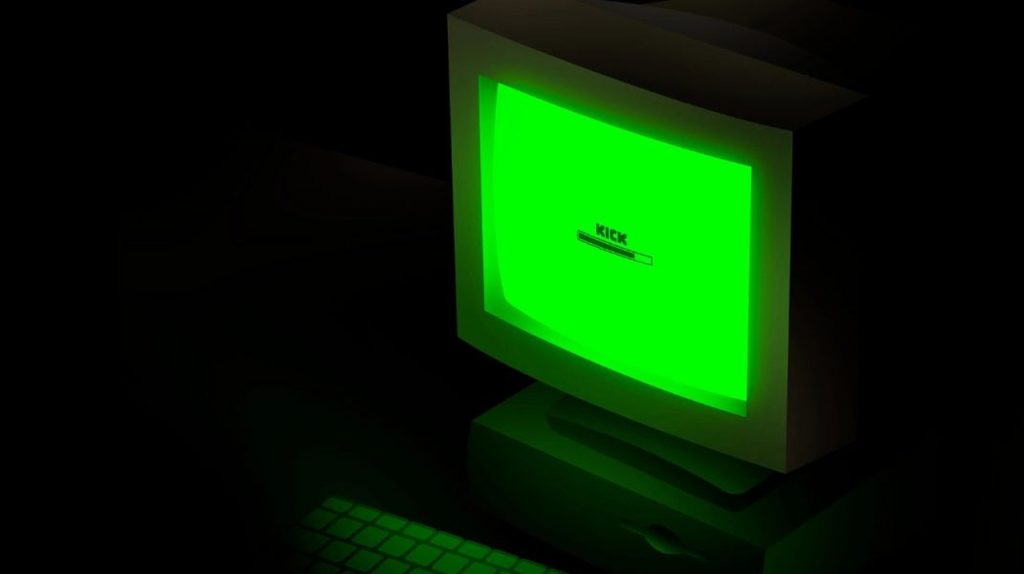 a computer with the kick logo on its screen